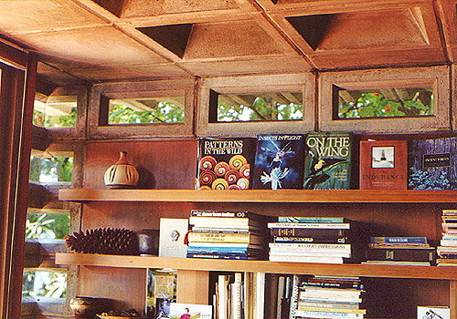 The living room bookshelves, clearstory and corner windows, and coffered ceiling. Image courtesy of Douglas Steiner. 