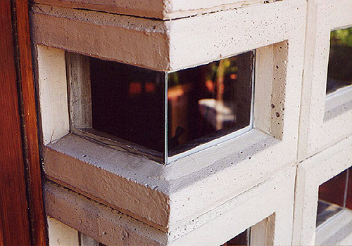 An exterior view of the mitered glass and perforated concrete block corner windows. Image courtesy of Douglas Steiner. 