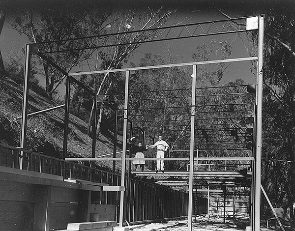 The Eames pose for a photograph as their house goes up in 1949. Image courtesy of the Library of Congress. 