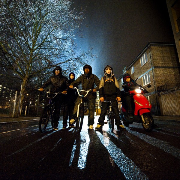 A group of teenage boys prepares to rob a woman in the film's opening scene. Image courtesy of Attack the Block. 