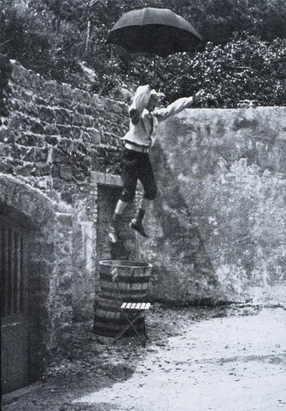 Zissou Jumping from a Wall with an Umbrella, early 1900s, by Jacques Henri Lartigue. Image courtesy of Artstor.  